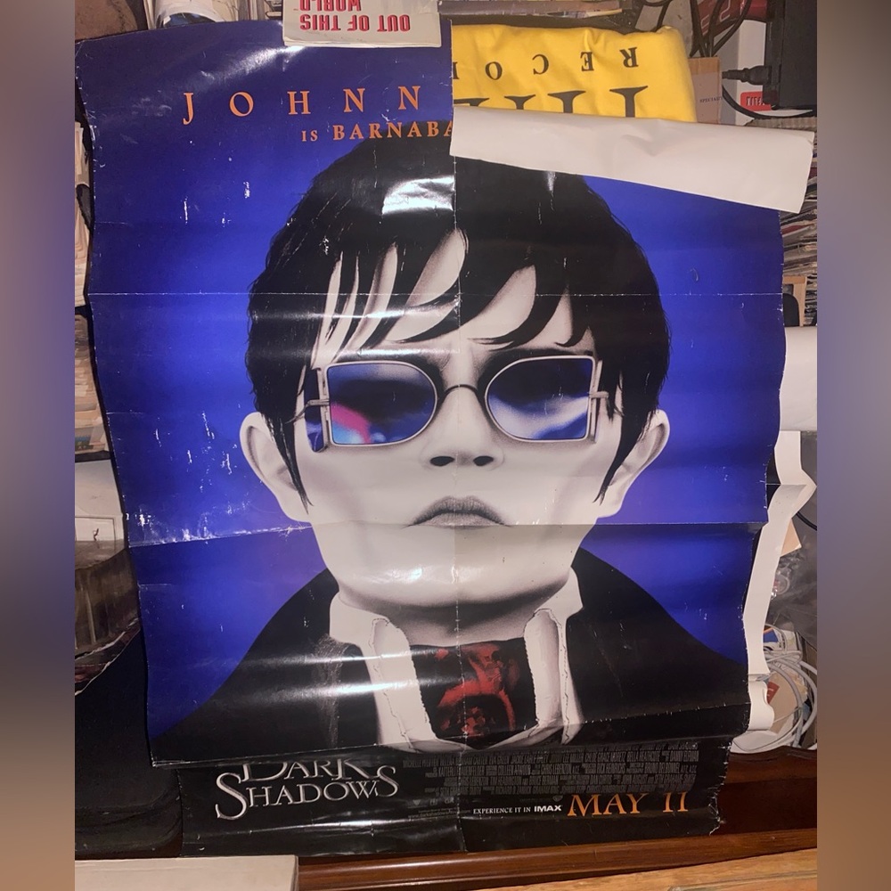 The poster is for the 2012 film Dark Shadows, directed by Tim Burton,